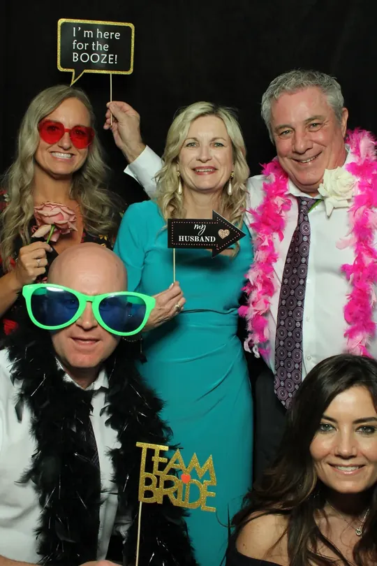 Guests with Team Bride props at a Dundas wedding photo booth in Hamilton