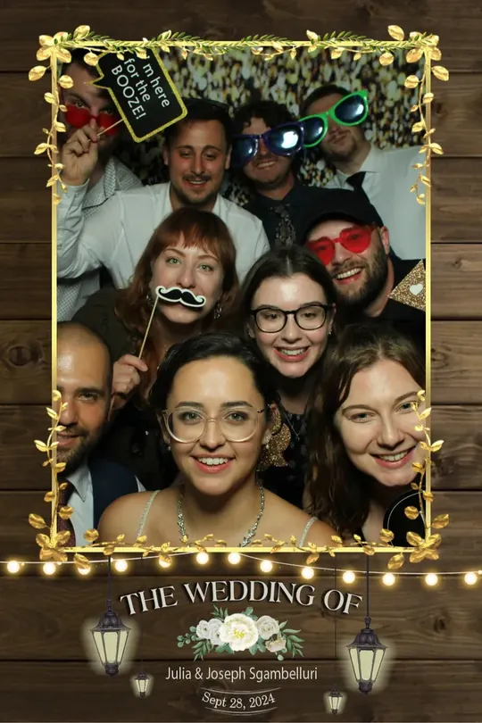 Big group of guests crowded into a Hamilton wedding photo booth