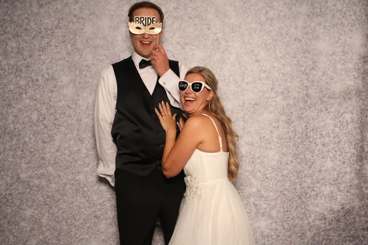 Bride and groom on the Silver Glitter backdrop