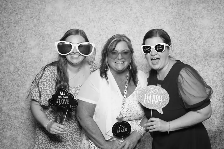Wedding guests on the Silver Glitter backdrop in black and white