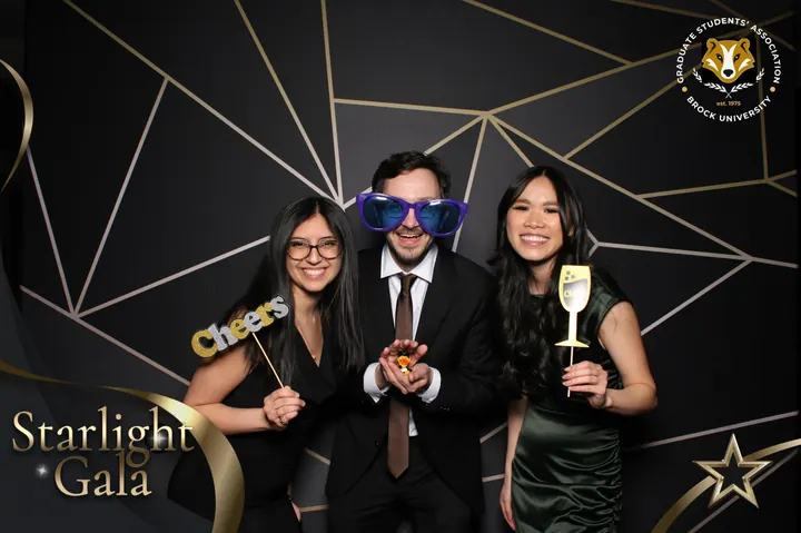 Three Starlight Gala guests with Cheers props and giant sunglasses, St. Catharines photo booth